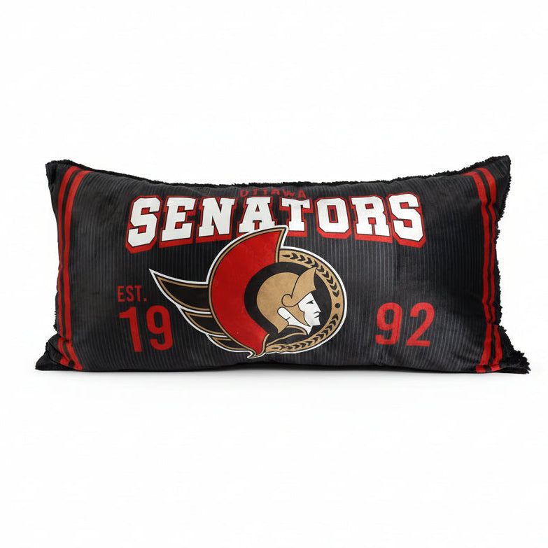 Black pillow with 'Ottawa Senators' branding featuring a logo and text.